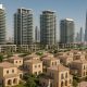 Modern Dubai skyline with upscale residential towers contrasting with affordable apartment buildings